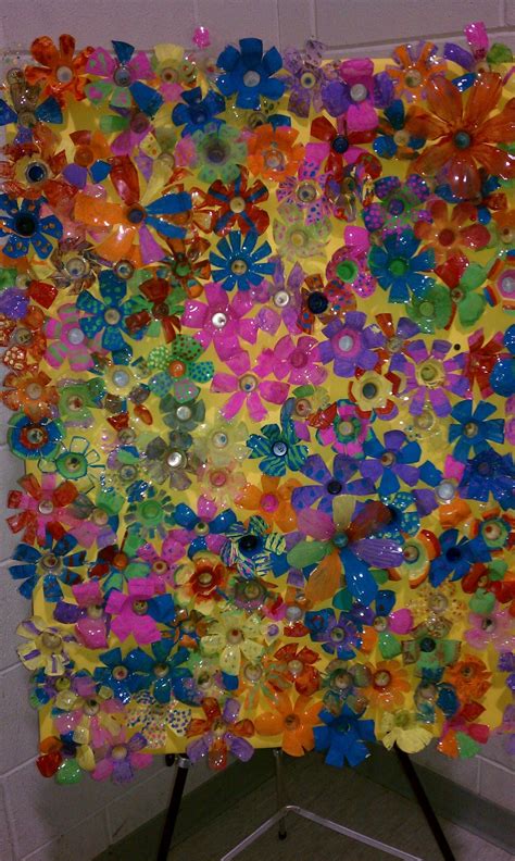 an art piece made out of plastic flowers