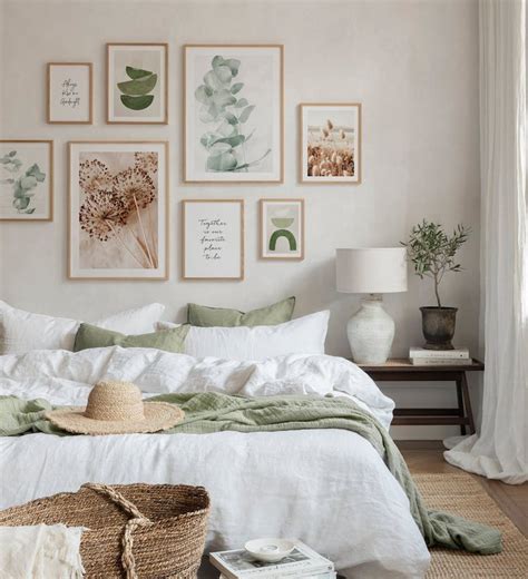 Gallery wall in beige and green tones with nature posters with oak frames for bedroom