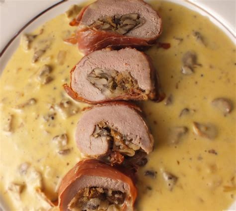 Mushroom stuffed pork tenderloin with truffled mushroom sauce