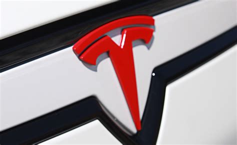 Tesla Logo Meaning and History [Tesla symbol]