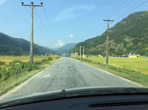 We were driving car to begging of the trekking on Nepal Himalayas through rice field in Nepal ...