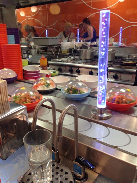 Yo Sushi Restaurant with revolving sushi and personal water taps for ...