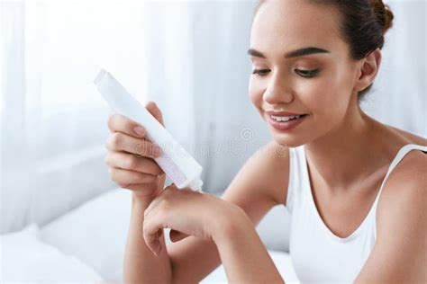 Hand Skin Care. Beautiful Woman Applying Cream on Hands Skin Stock ...