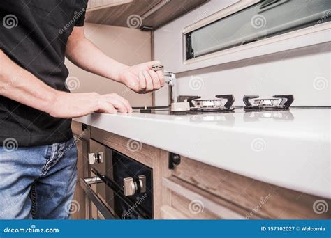 Camper Van Stove Repair stock image. Image of cook, profession - 157102027