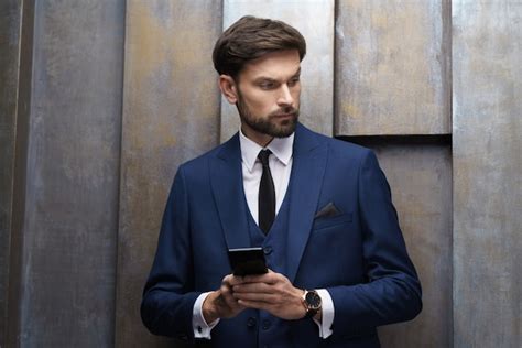 Premium Photo | Young stylish businessman wearing suit