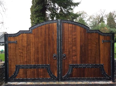 A mix of wood and wrought iron electric gates | Front gate design, Door gate design, Gate design