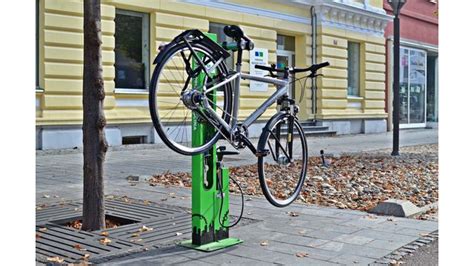 Public bike repair stand with pump