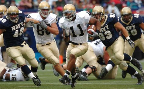 Group of Male Football Players Running on Field during Day · Free Stock ...