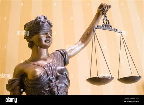 Bronze statue of "Lady Justice", blindfolded and holding a pair of scales Stock Photo - Alamy