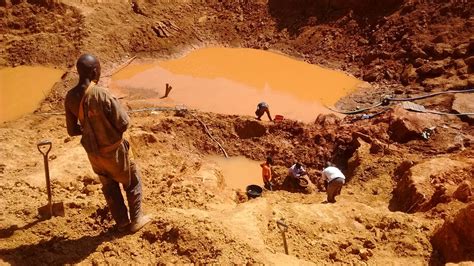 Miners working on the open pit