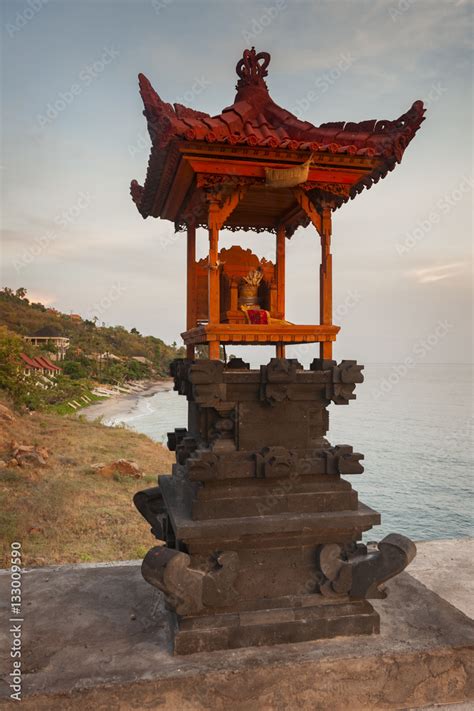 Bali Hindu Shrines During Sunrise. A majestic and dramatic sunrise illuminates a Balinese Hindu ...