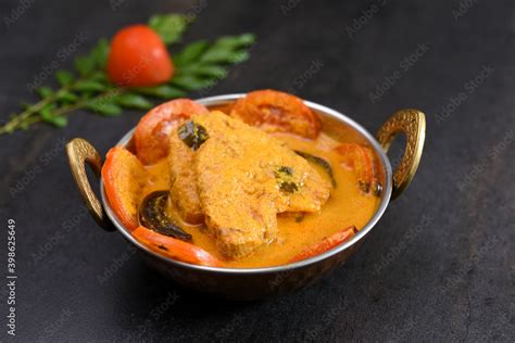 Kerala fish curry coconut milk gravy , cooking spicy Goan fish curry ...