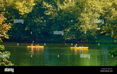 Family kayaking on Dordogne river Stock Photo - Alamy