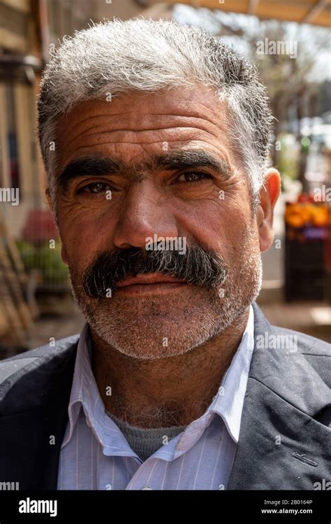 Susuz, Turkey - May 9, 2019: Turkish man with hat, moustache and beard in a turkish cafe Stock ...