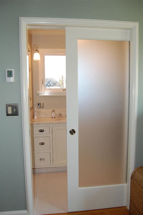 Show me photos of pocket doors for bathrooms