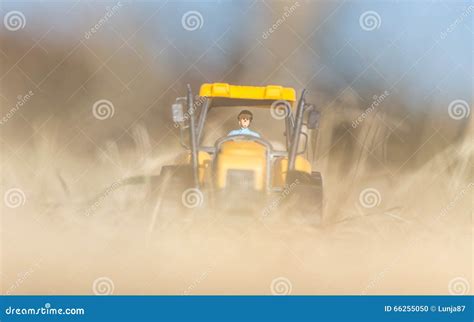 Small yellow toy tractor stock photo. Image of exhibition - 66255050