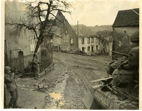 Troops patrol the town of Bining, France on 13 December 1944 | The ...