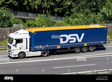 DSV truck on motorway. DSV A/S is a Danish transport and logistics company offering transport ...