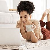 Computer remote work, black woman and living room floor with morning coffee working on an email ...