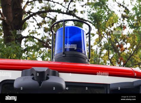 blue flashing light on the roof of a fire truck close up Stock Photo - Alamy