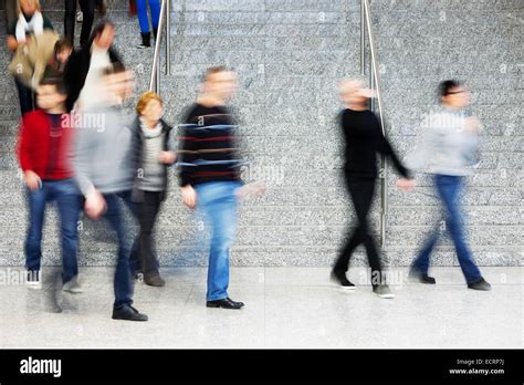 Motion Blur of People Walking on Stairs Stock Photo - Alamy