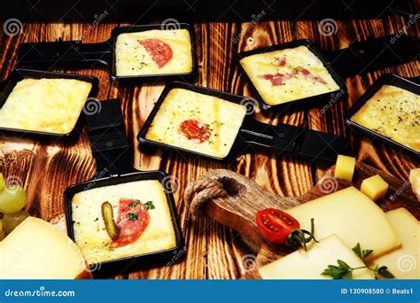 Delicious Traditional Swiss Melted Raclette Cheese Served in Ind Stock ...