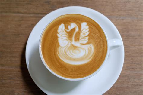 Coffee latte art in coffee shop 11042171 Stock Photo at Vecteezy