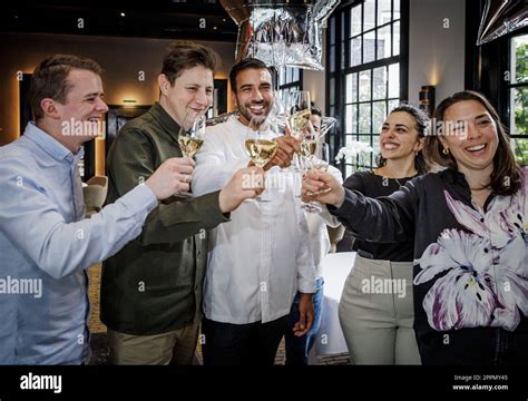 AMSTERDAM - Staff of restaurant Vinkeles celebrates after obtaining a second Michelin star. Chef ...