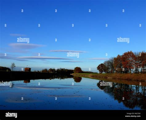 blue sky with river reflection Stock Photo - Alamy