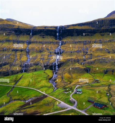 Aerial view of waterfalls in the village of Saksun on the Faroe islands ...