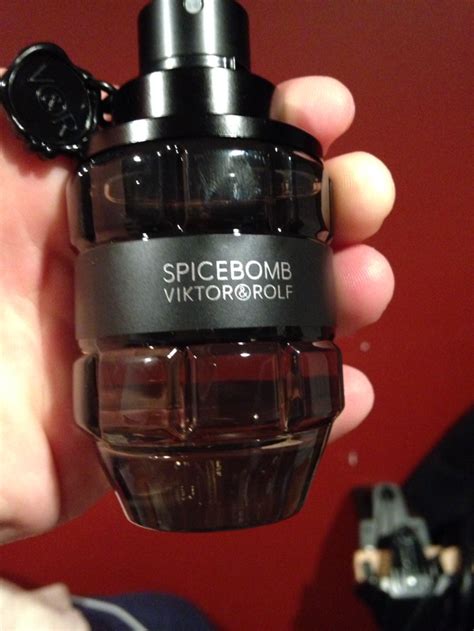 This bottle of cologne is shaped like a grenade with a pin : r/mildlyinteresting