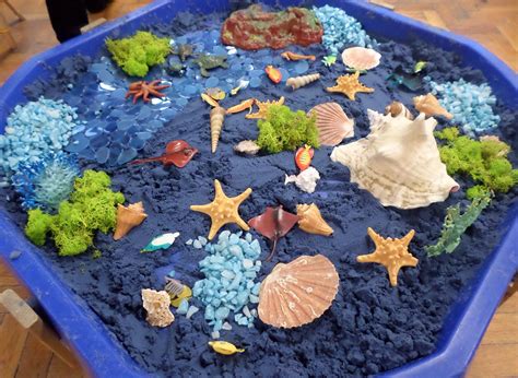 Blue sand and sea creatures and shells! Childcare Activities, Nursery Activities, Sensory ...
