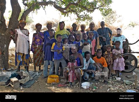 group of African villagers posing for the camera in their village Stock Photo - Alamy