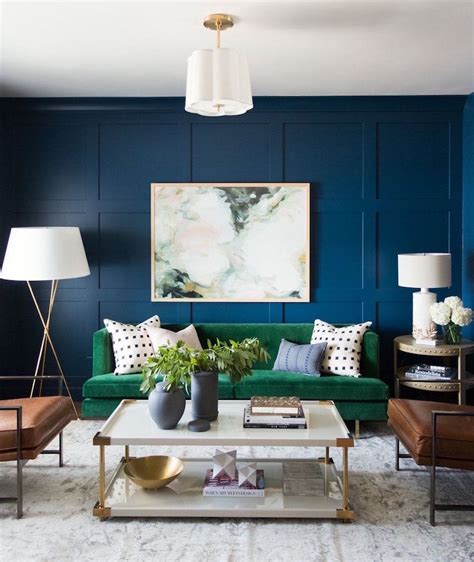 studio mcgee dark blue walls with green sofa living room - Laurel Home