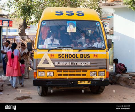 Indian school bus going through the indian town Puttaparthi. Andhra ...