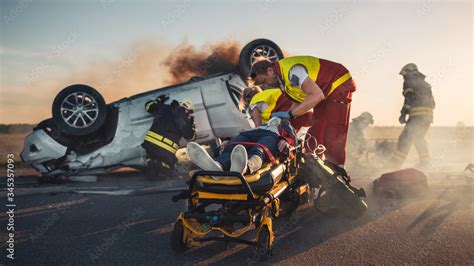 On the Car Crash Traffic Accident Scene: Paramedics Save Life of a ...