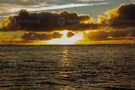 Sunset clouds in the sea 21735477 Stock Photo at Vecteezy