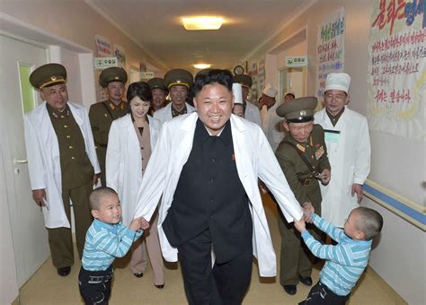 File photo shows North Korean leader Kim Jong un playing with children during a visit to the ...