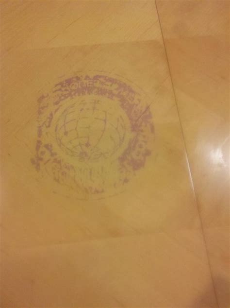 repair - How do I get a plastic bag logo stain off my finished wood table? - Home Improvement ...