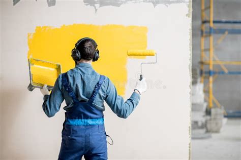 Painter Listening To the Music during the Work Stock Photo - Image of male, helmet: 112962628