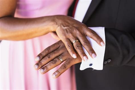 Premium Photo | Black ethnic wedding couple showing rings at a wedding marriage ceremony