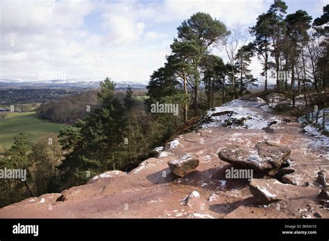 View of Alderley Edge and the Cheshire plain from Alderley Edge, after light snow. Cheshire UK ...