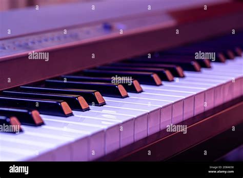 Piano keys on a beautiful colored background. Close up Stock Photo - Alamy