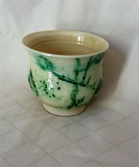 Copper oxide painted on green ware. | Potters wheel, Oxide paint, Tableware