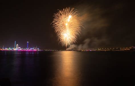 Fireworks in Night Sky above Water · Free Stock Photo