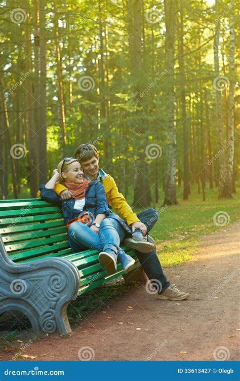 Young Couple on a Park Bench Stock Image - Image of park, caucasian: 33613427