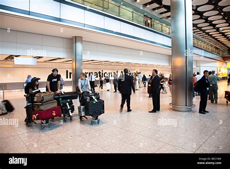 People at international arrivals Heathrow airport London England UK Stock Photo - Alamy