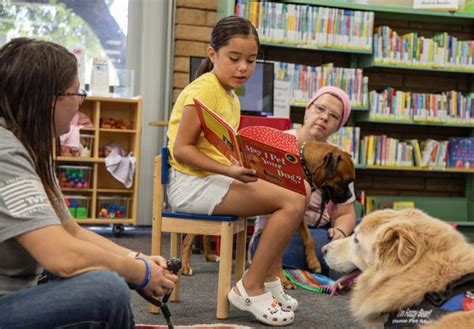 Local children “read to a dog” at Reedley library - Mid Valley Times