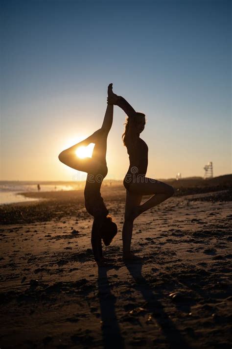 Women Doing Yoga on the Beach at Sunset at Horseneck Beach Editorial ...