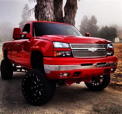 Lifted Red Chevy :) Just something about that color on a Chevy, I ...